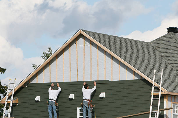 Professional Storm Damage Siding Repair technician working in Windsor, VA